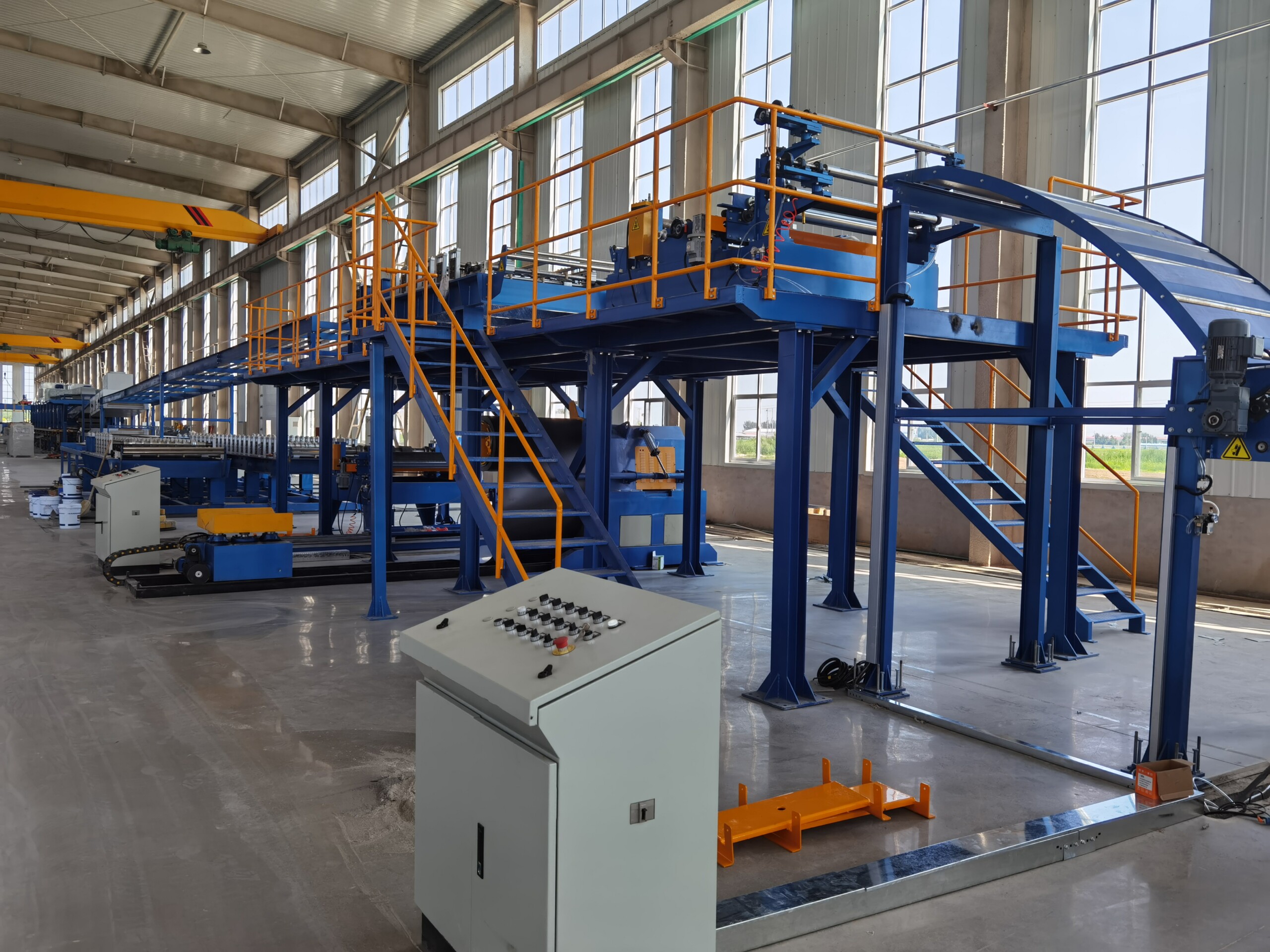 full view of sandwich panel production line in operation